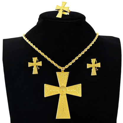 Gold cross necklace and earrings set on a black mannequin