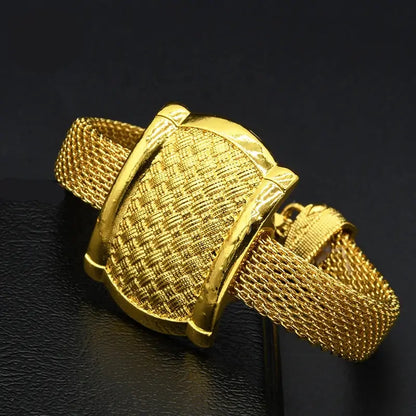 Gold bracelet on a black background