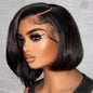 Woman with a black bob wig against a textured gray background