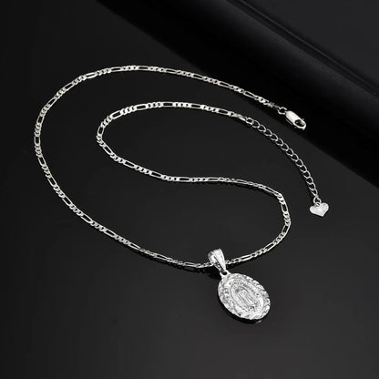 Silver chain necklace with a pendant on a black background