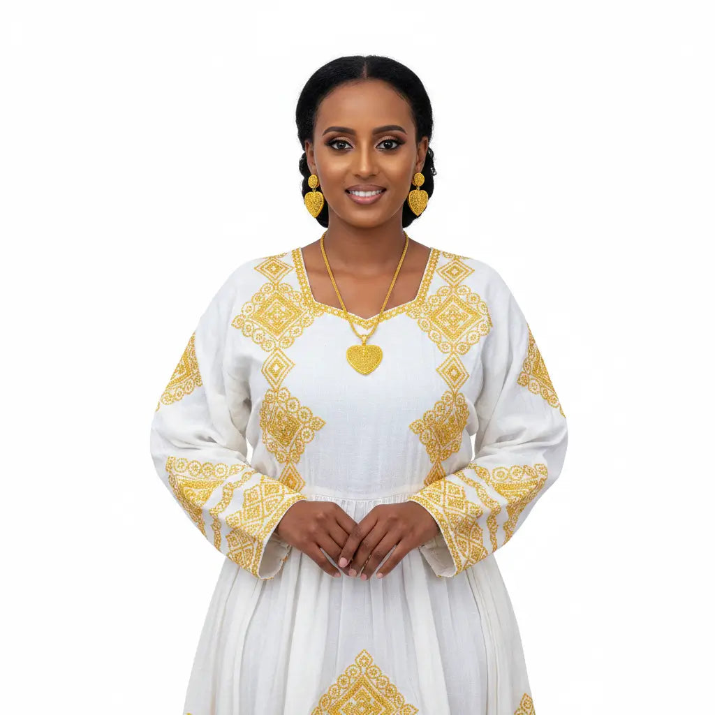 Woman wearing a white dress with gold embroidery on a white background