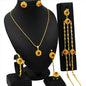 Gold jewelry set with necklace, earrings, and hair accessories on a black mannequin.