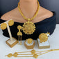 Gold jewelry set including necklace, earrings, and bangles on a mannequin and white surface.