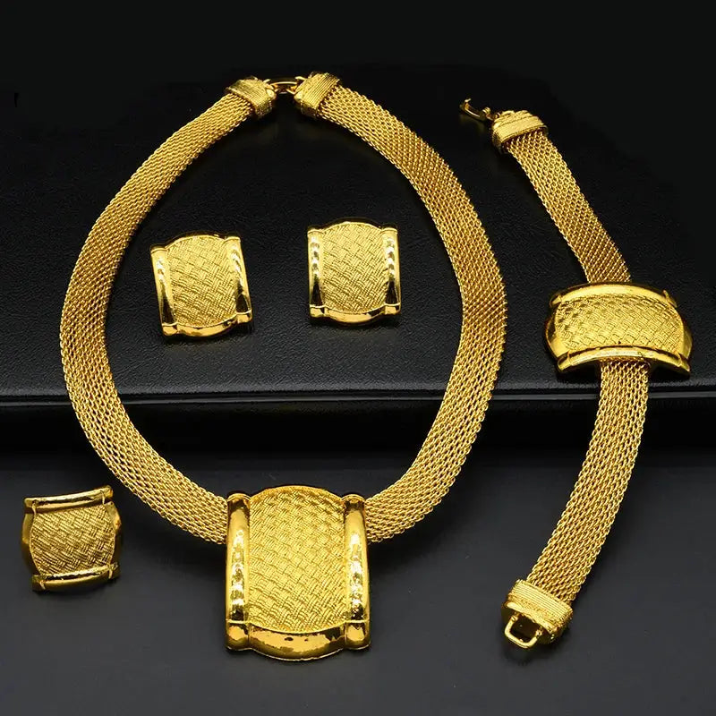 Gold jewelry set including necklace, bracelet, and earrings on a black background