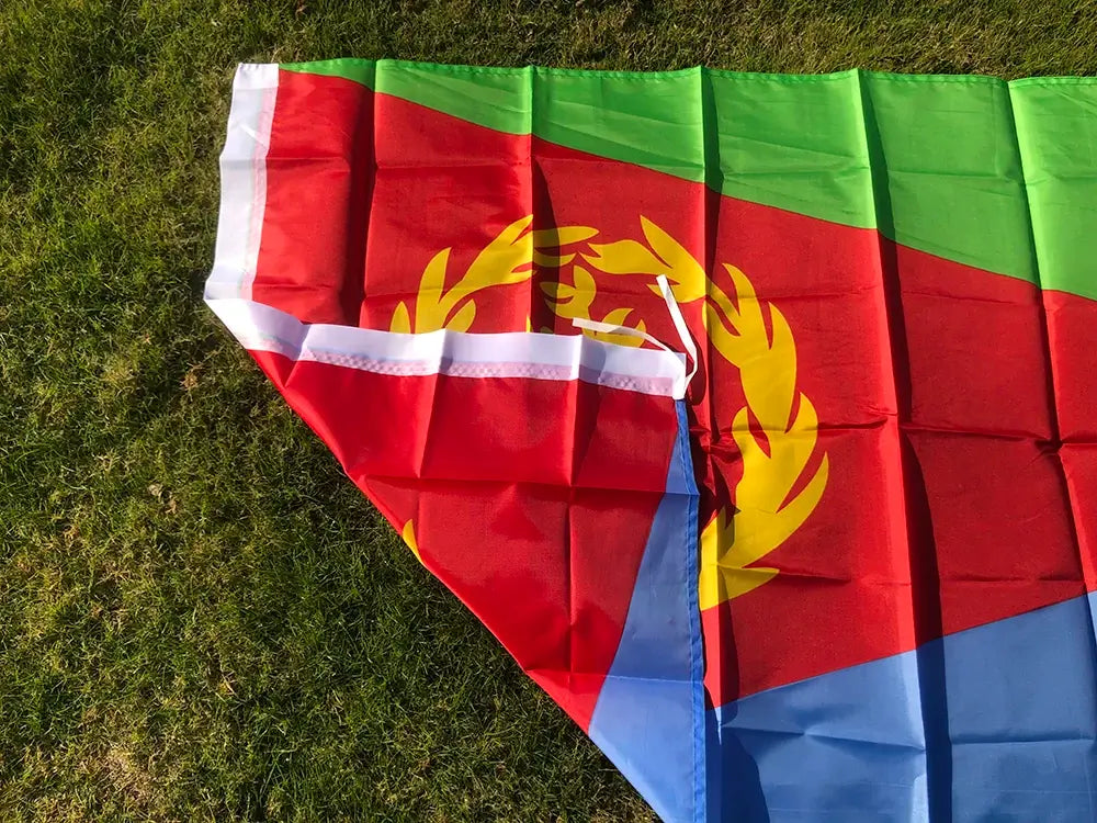 Flag of Eritrea on a grassy background